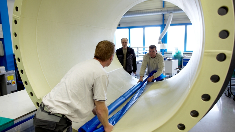 Endress+Hauser Flow France, Cernay, men looking through flowmeter with large diameter